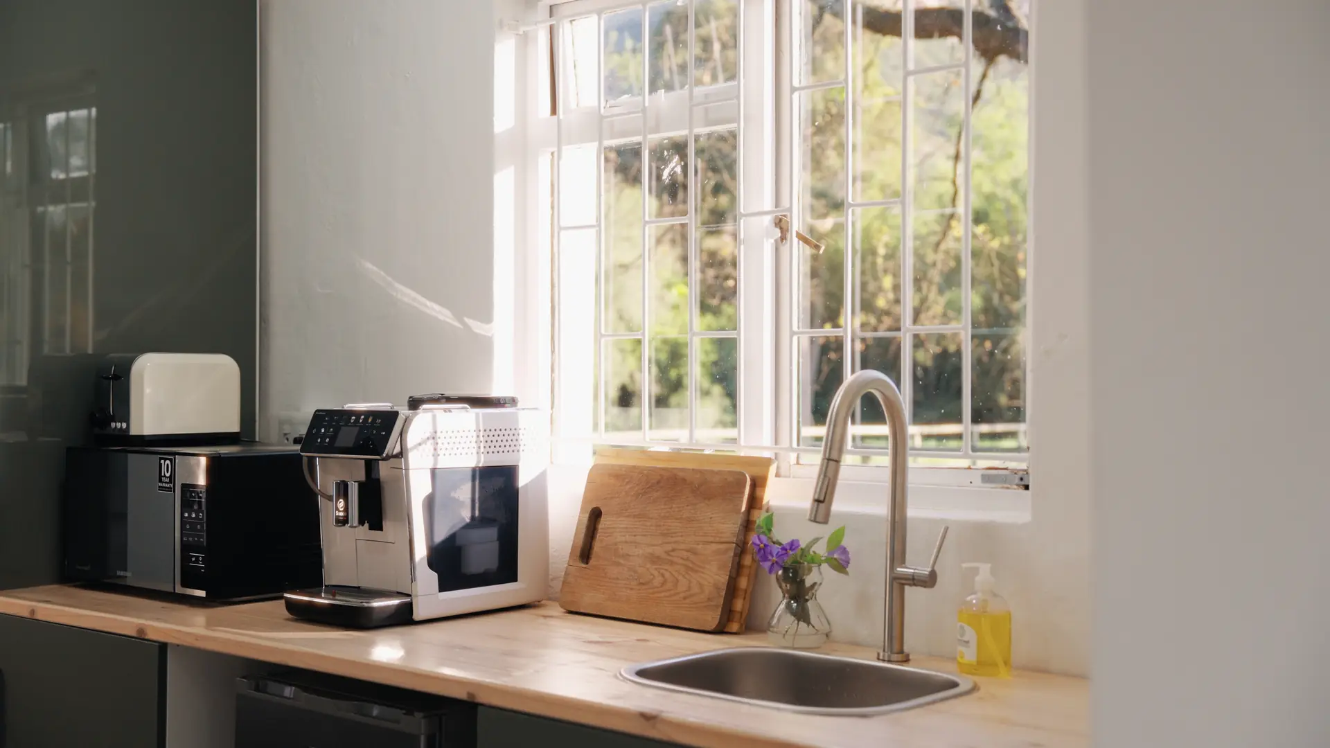 The coffee corner of the cottage at Banhoek Stud, under a sunny window