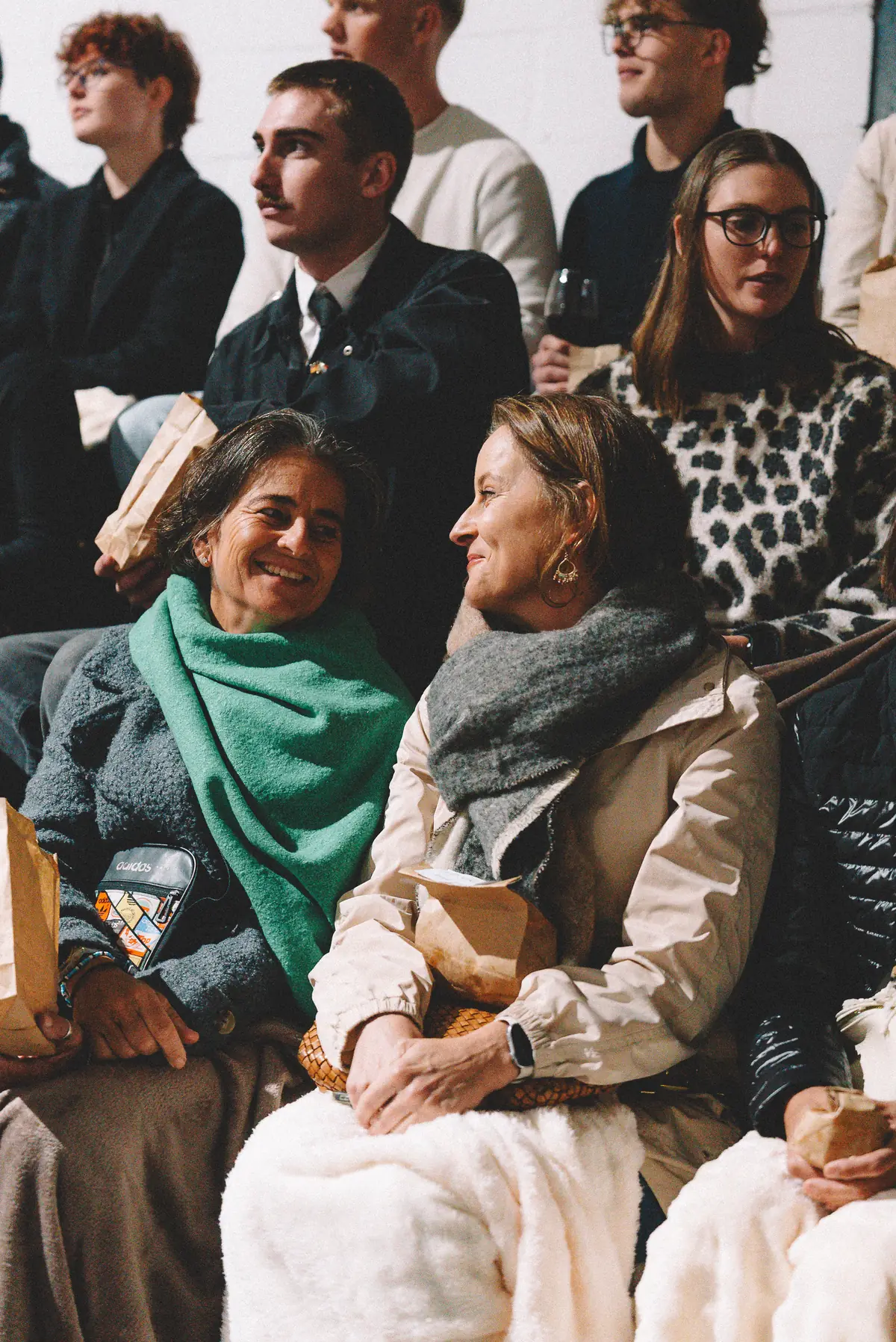 The seated audience watching the screening in the indoor arena at Banhoek Stud