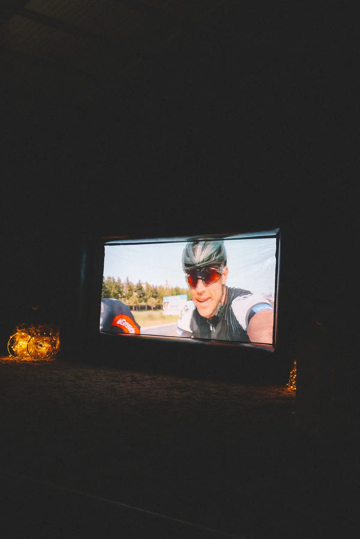 The film playing on the big screen in the darkened arena at Banhoek Stud, fairy lights glowing beside it